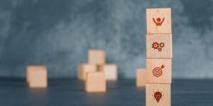 conceptual-business-with-wooden-blocks-column-with-icons